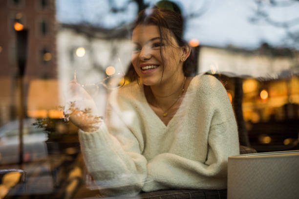istock Young beautiful female having a break in cafeteria. 908030854