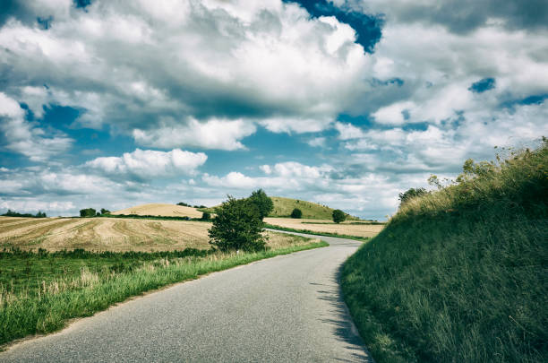 istock Single lane country road 908031304