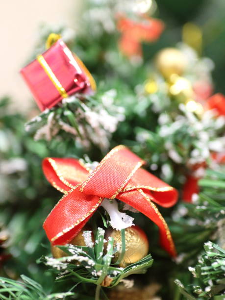 istock Christmas tree cones red box of angels 908031398