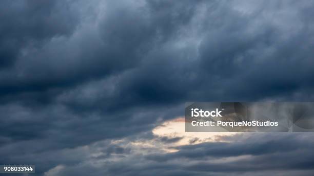 Storm Clouds In The Sky With Clear Patch In The Center Stock Photo - Download Image Now