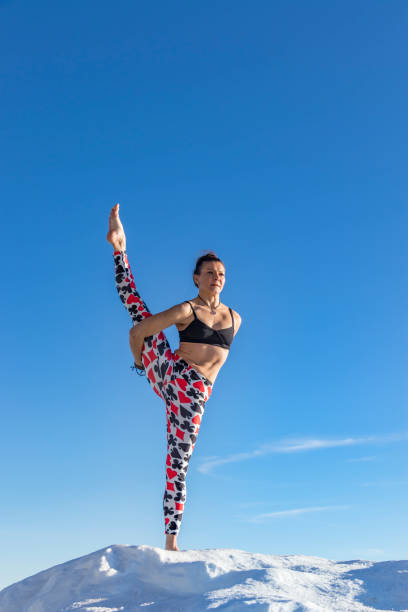 istock A beautiful woman doing yoga 908034030