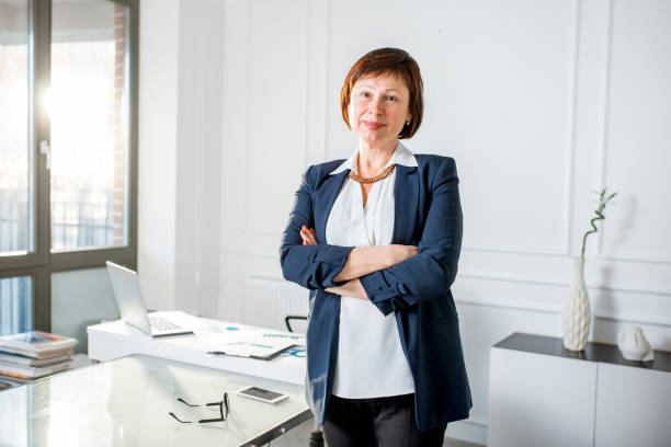 istock Senior woman at the office 908034048