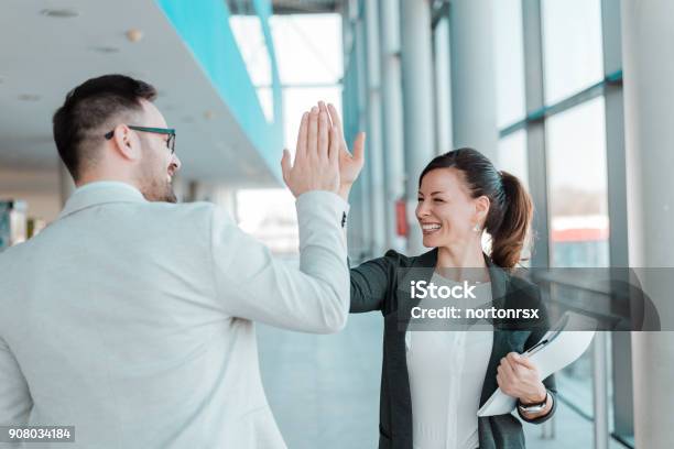 Two Business People Highfive Job Well Done Stock Photo - Download Image Now - High-Five, Business, Celebration