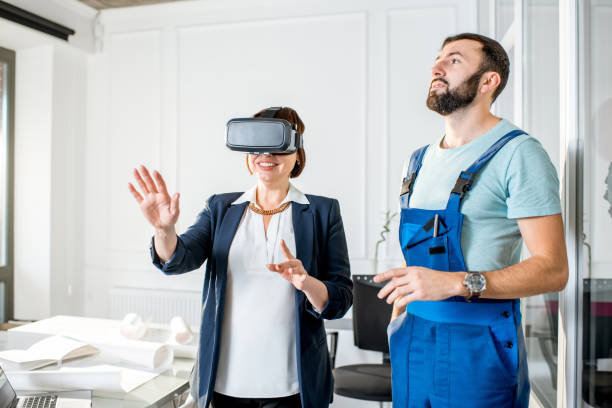 istock Senior woman using vr glasses to imagine or design a project 908035556
