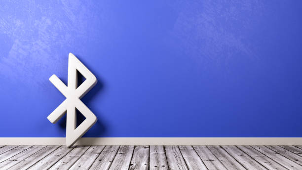 Bluetooth Symbol on Wooden Floor Against Wall White Bluetooth Symbol Shape on Wooden Floor Against Blue Wall with Copyspace 3D Illustration bluetooth stock pictures, royalty-free photos & images