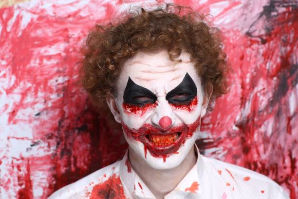 istock halloween make up man crazy clown 908043130