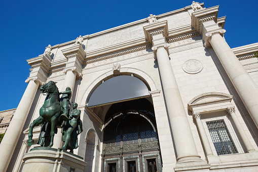 NEW YORK - SEPTEMBER 13: American Museum of Natural History building facade with Theodore Roosevelt equestrian statue in a sunny day, blue sky on September 13, 2016 in New York. This is one of the largest museum of natural history of the world.