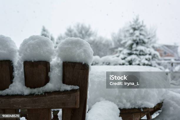Winter Snowfall In The Garden Table And Chairs Covered With Snow Stock Photo - Download Image Now