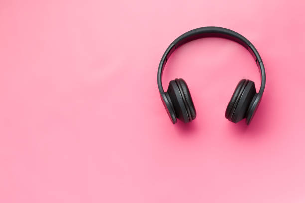 istock wireless headphones on pink background 908048746