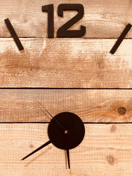 istock Close up of wooden clock face 908055000