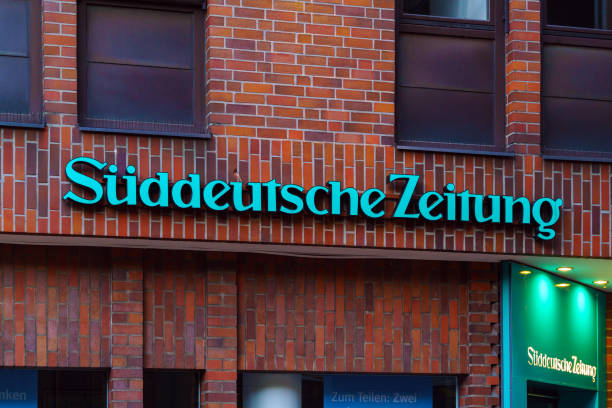 Suddeutsche Zeitung street sign Munich, Germany - October 14, 2017: Sign of the newspaper Suddeutsche Zeitung on the building in the city centre süddeutsche zeitung photos stock pictures, royalty-free photos & images