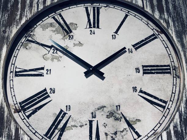 istock Close up of clock face 908055198