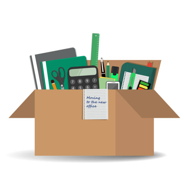 istock Office accessories in a cardboard box. 