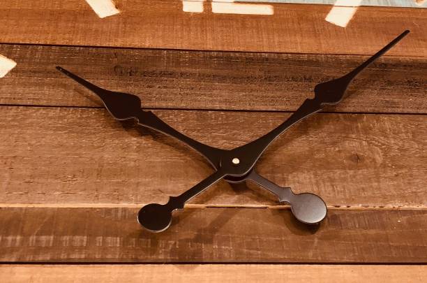 istock Close up of brown wooden clock face 908055348