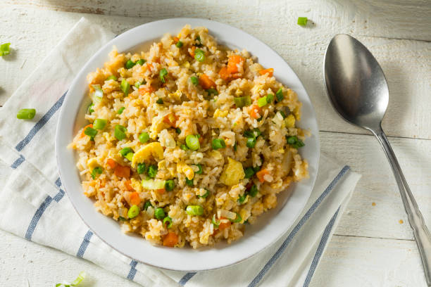Homemade Vegetarian Fried Rice Homemade Vegetarian Fried Rice with Egg Peas and Carrots fried rice stock pictures, royalty-free photos & images