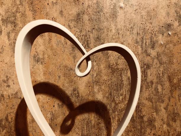 istock Abstract heart on brown shappy chick wall 908062210