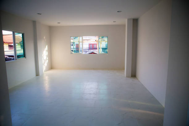 istock Incomplete renovate white room without windows, empty white room.  apartment building. interior and renovation concept. 908062824