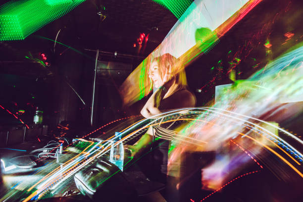 istock Female Techno Music Artist Mixing 908063540