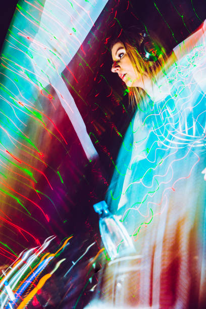 istock Female Techno Music Artist Mixing 908063548