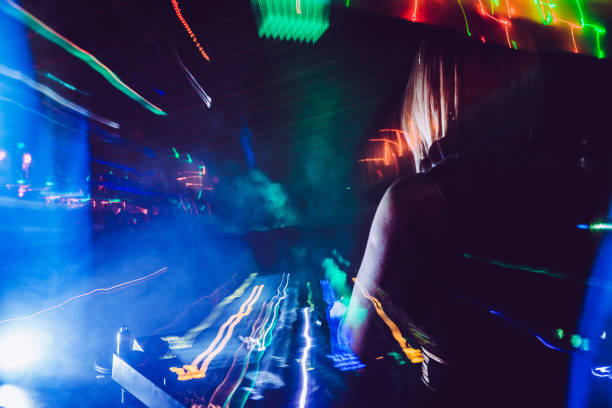 istock Young Female DJ Performing in Nightclub 908063556