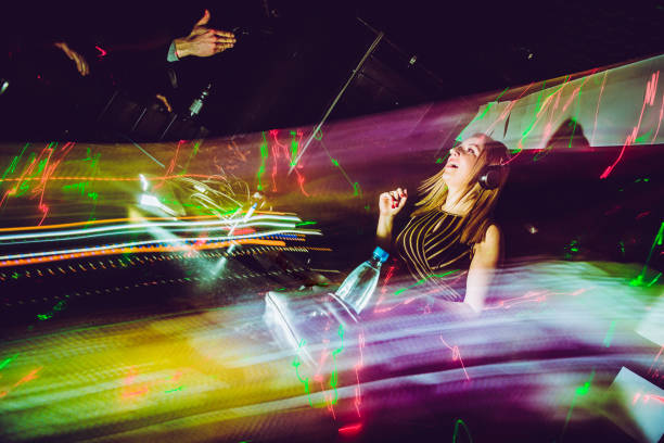 istock Female Techno Music Artist Mixing 908063614