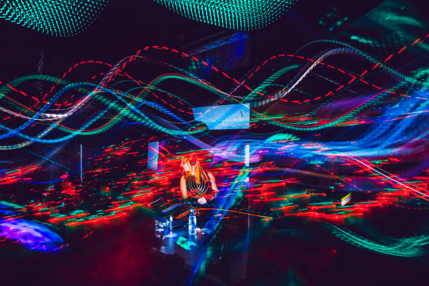 istock Young Female DJ Performing, Light Painting 908064922