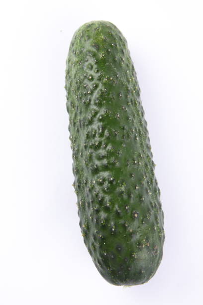 istock Cucumber on white background, fresh vegetables, minimalism, empty space, top view, cucumber, healthy food, diet, packaging design 908075568