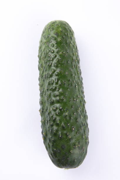 istock Cucumber on white background, fresh vegetables, minimalism, empty space, top view, cucumber, healthy food, diet, packaging design 908075586