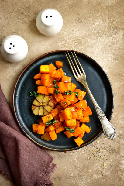 istock Roasted spicy pumpkin with honey, garlic and thyme 908077742