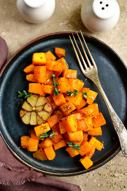istock Roasted spicy pumpkin with honey, garlic and thyme 908077820
