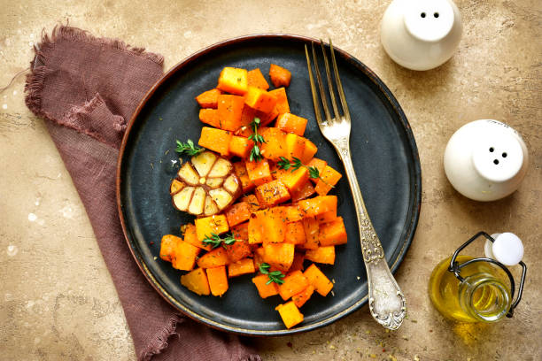 istock Roasted spicy pumpkin with honey, garlic and thyme 908077866