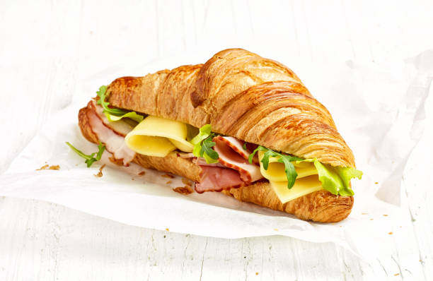 istock croissant sandwich with ham and cheese 908078228