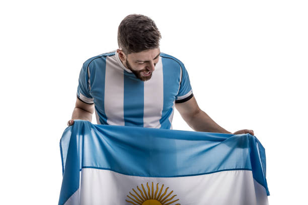 istock Argentinian male athlete / fan celebrating on white background 908080574
