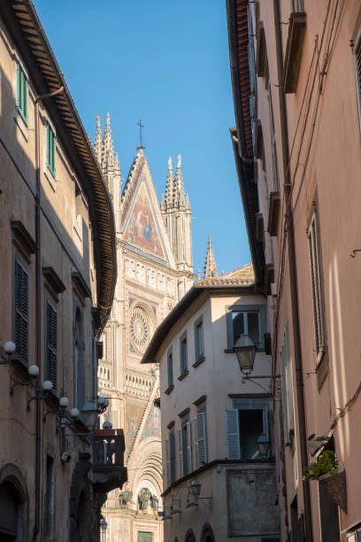 istock Orvieto (Umbria, Italy), old street and cathedral 908083520