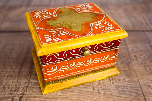 Old yellow box with Indian pattern stock photo