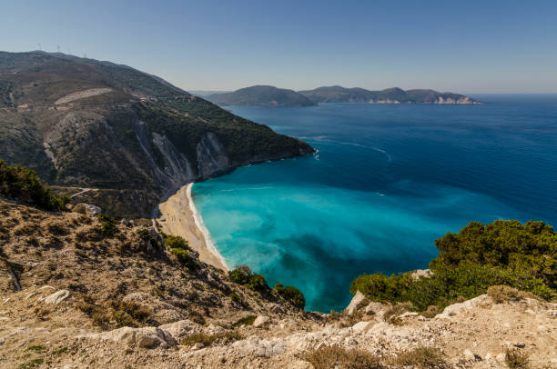 istock myrtos beach nestled between the mountains Agia Dynati and Kalos Oron 908092086