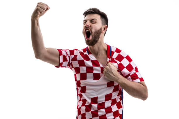 istock Croatian male athlete / fan celebrating on white background 908110930