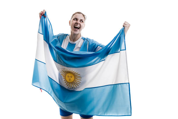 istock Argentinian female athlete / fan celebrating on white background 908111576
