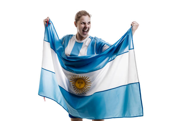 istock Argentinian female athlete / fan celebrating on white background 908111578