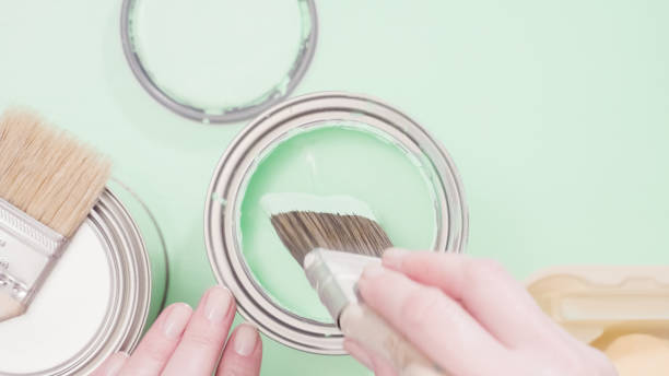 istock Opened metal paint can with blue color paint 908122056