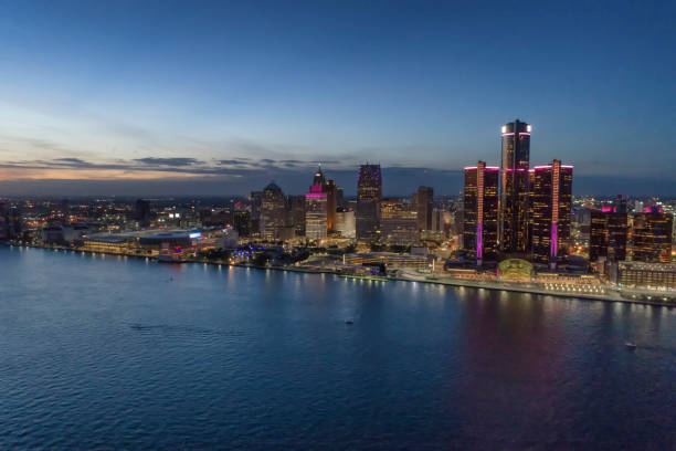 istock Detroit skyline reflected in water during sunset 908123442