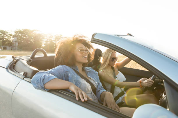 istock Girls traveling with car 908123598