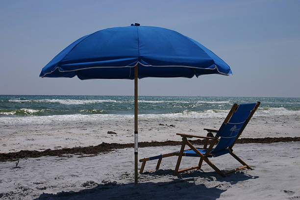 istock Beach chair and umbrella 90812510