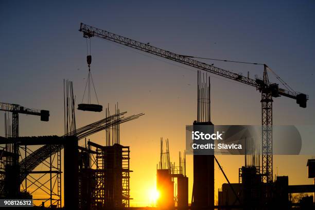 Silhouette Of Modern Construction Site At Dusk Stock Photo - Download Image Now - Skyscraper, Rebuilding, Engineering
