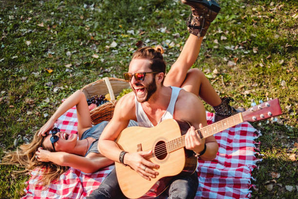 istock Couple laughing on a picnic 908126730