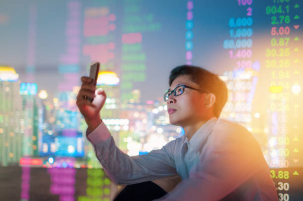 istock Business analysis stockmarket with digital tablet  with skyscaper background 908129956