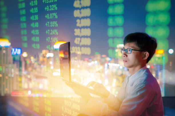istock Business analysis stockmarket with digital tablet  with skyscaper background 908129958