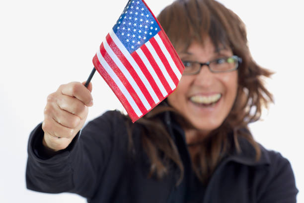istock Woman waving an American Flag 908134766