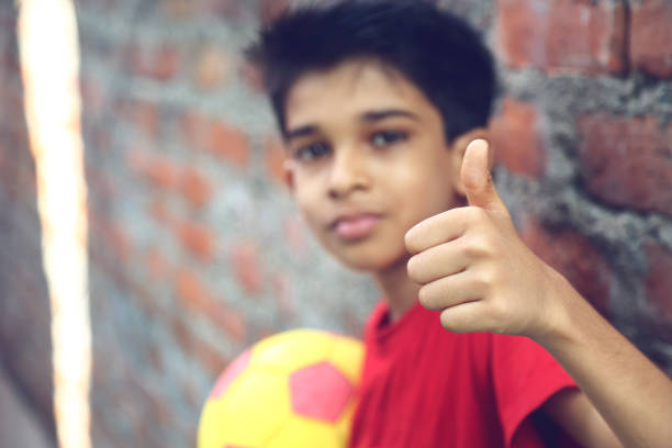 istock Little Boy showing a thumbs up sign 908138010
