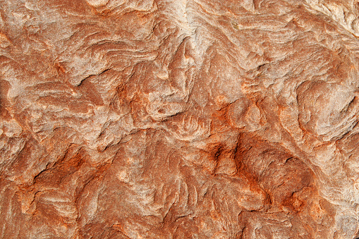 Close up texture of dry red dirt desert area in the middle of the Australian outback